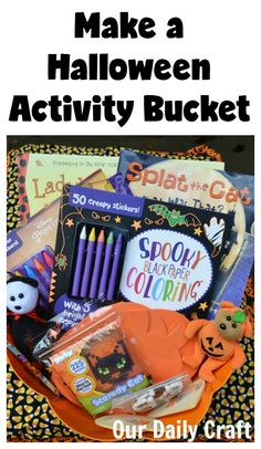 a basket filled with lots of halloween activities and books for kids to play with on the table