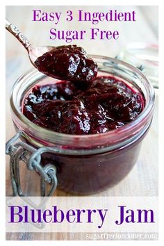 blueberry jam in a glass jar with a spoon full of it and the words easy 3 ingredient sugar free