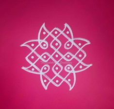 an intricate white design on a pink background