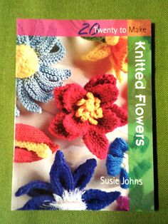 a book with crocheted flowers on it