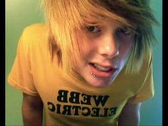 a young man with blonde hair wearing a t - shirt that says web electric on it