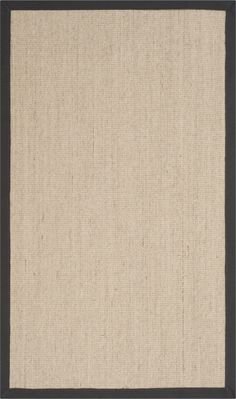 a beige rug with black border