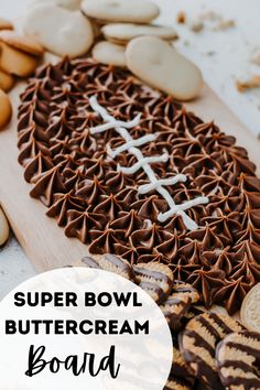 a close up of a plate of food with cookies and other items around it that says super bowl buttercream board