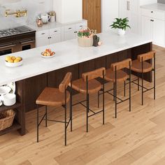 a large kitchen island with six chairs in front of it and a bowl of fruit on the counter