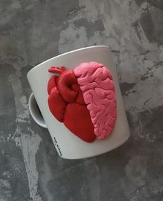 a cup with a red heart on it