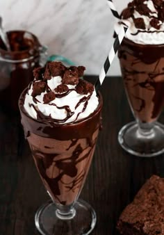 two glasses filled with ice cream and chocolate