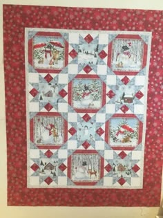 a red and white quilted wall hanging