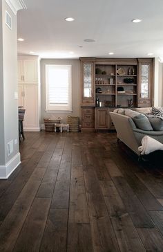 an image of a living room with wood flooring on the walls and wooden floors