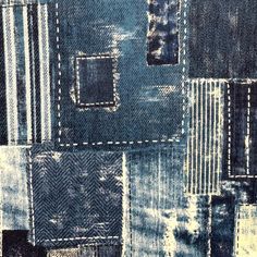 a blue patchwork fabric with white stitchs