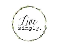 the words live simply written in black ink on a white circle with leaves around it