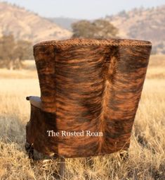 the rusted iron chair sits in an open field