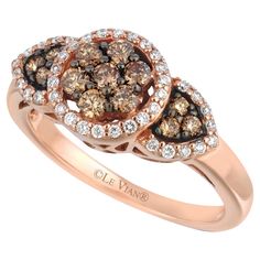 two brown and white diamonds are set in an 18k rose gold ring, with the words ole vann written on it