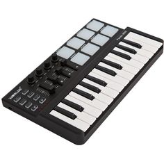 an electronic keyboard with white keys and black knobs