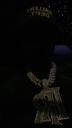 the back of a person's hat in the dark with lights on it and stars all around