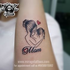 a mother and child tattoo on the arm that says mom with a heart in it