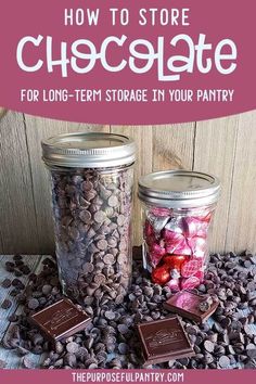 two jars filled with chocolate and candy sitting on top of a table next to each other