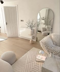 a living room filled with furniture and mirrors