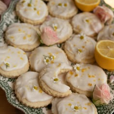 lemon and white frosted cookies on a plate