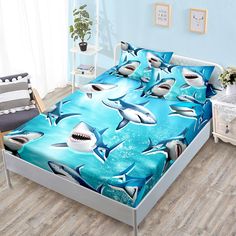 a bed room with a neatly made bed and a chair next to the bed covered in sharks