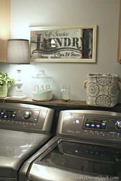 a washer and dryer sitting next to each other on top of a counter