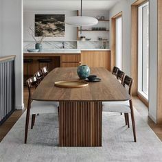 a dining room table with chairs around it