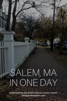 a white picket fence with the words salem ma in one day on it's side