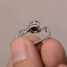 This is a gorgeous handmade creation. Its beauty is its simplicity & Elegance. The 7*7 mm round shape faceted natural Black Spinel is crafted in solid sterling silver and with rhodium plated. All item is sent in a beautiful gift box If you have any idea of design your ring,pls contact me directly. You can realize more lovely stuff clicking the link https://www.etsy.com/shop/knightjewelry?refshopsection_shophome_leftnav Please leave the correct address and you phone number for delivering succ Black Birthstone Rings For Anniversary, Black Birthstone Rings, Black Birthstone Ring Gift, Black Birthstone Rings For Gifts, Black Cubic Zirconia Crystal Ring For Gift, Infinity Gemstone Rings For Gifts, Diamond Halo Ring With Round Stone As Gift, Halo Ring With Solitaire Round Cut For Gift, Black Sapphire Round Cut Ring Gift