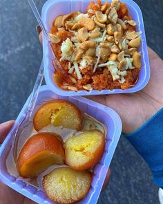 two plastic containers filled with fruit and nuts