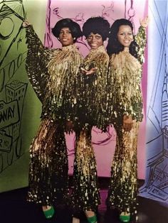 three women in gold sequins posing for a photo