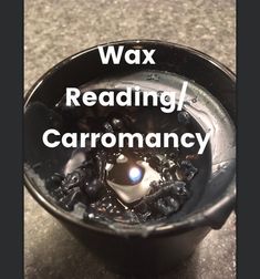 a black cup with the words wax reading / carromancy in it's center