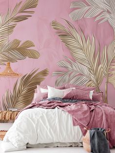 a bedroom with pink walls and gold leaf wallpaper