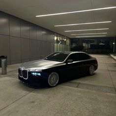 a black car parked in front of a building