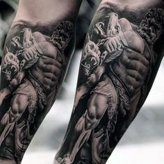 a man's leg with tattoos on it and an image of a demon in the middle