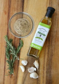 an image of garlic and seasoning on a wooden table with ingredients to make it