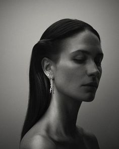 black and white photograph of woman with earrings