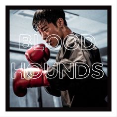 a man wearing red boxing gloves with the words blood hounds