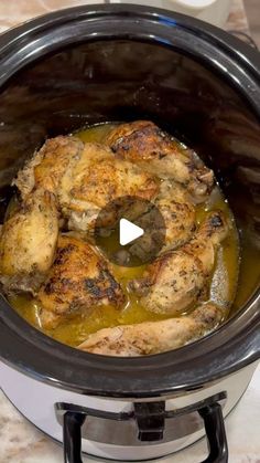 a slow cooker with some chicken in it