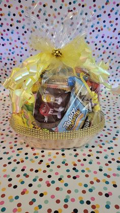 a basket filled with candy and candies on top of a table