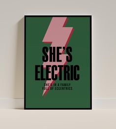 she's electric poster in green and pink with lightning bolt on the bottom right side