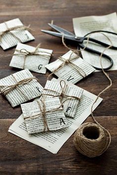 old book pages tied up with twine and scissors