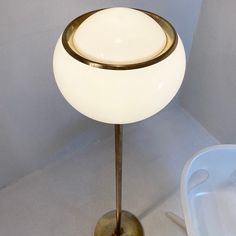 a table lamp sitting on top of a white floor