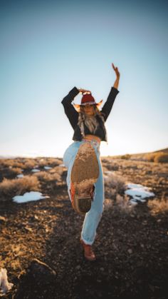 a person jumping up in the air with a skateboard on their hands and legs