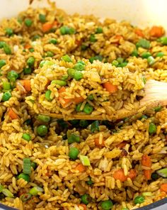 rice and peas are mixed together in a pan