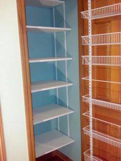 an empty closet with shelves in it