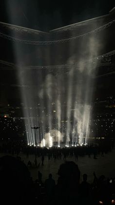 fireworks are lit up in the middle of an arena