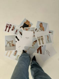 a person standing on the ground with their feet up and several pictures laid out in front of them