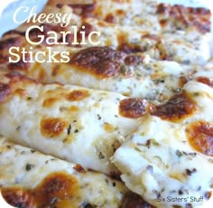 cheesey garlic sticks are stacked on top of each other with the words, cheesy garlic sticks