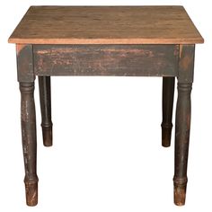 an old wooden table with two legs and a small drawer on the top, isolated against a white background