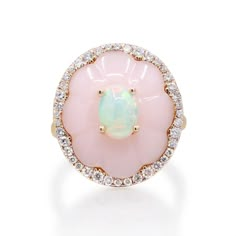 With the CIRARI 14K Yellow Gold Pink Opal and Ethiopian Opal Halo Ring, discover captivating brilliance. Carefully made, this ring has an enthralling display of 0.41 carats worth of pink and Ethiopian opals encircled by a brilliant halo. The design, set in glossy 14K yellow gold, combines classic charm with contemporary elegance. This CIRARI masterpiece will elevate your style since it is a representation of timeless beauty and tasteful design in every way. Ethiopian Opal Rings Fine Jewelry, Elegant Hallmarked Ethiopian Opal Ring, Sailor Moon Ring, Elegant Ethiopian Opal Ring, Hallmarked, Pink Opal Ring, Pink Halo, Elegant Ethiopian Opal Ring, Oval Cabochon, Opal Diamond Ring, Opal Engagement Ring