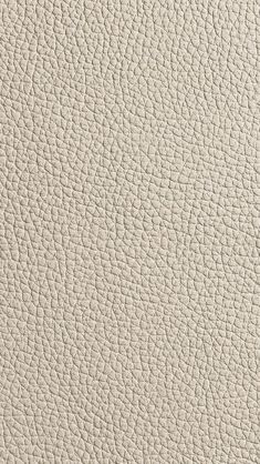 an up close view of the texture of a white leather material, which is very soft